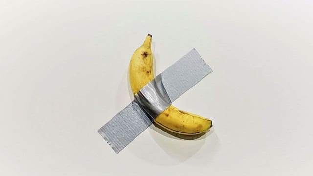 Maurizio Cattelan’s banana taped on a wall sold for $6.2 million and became a “masterpiece”