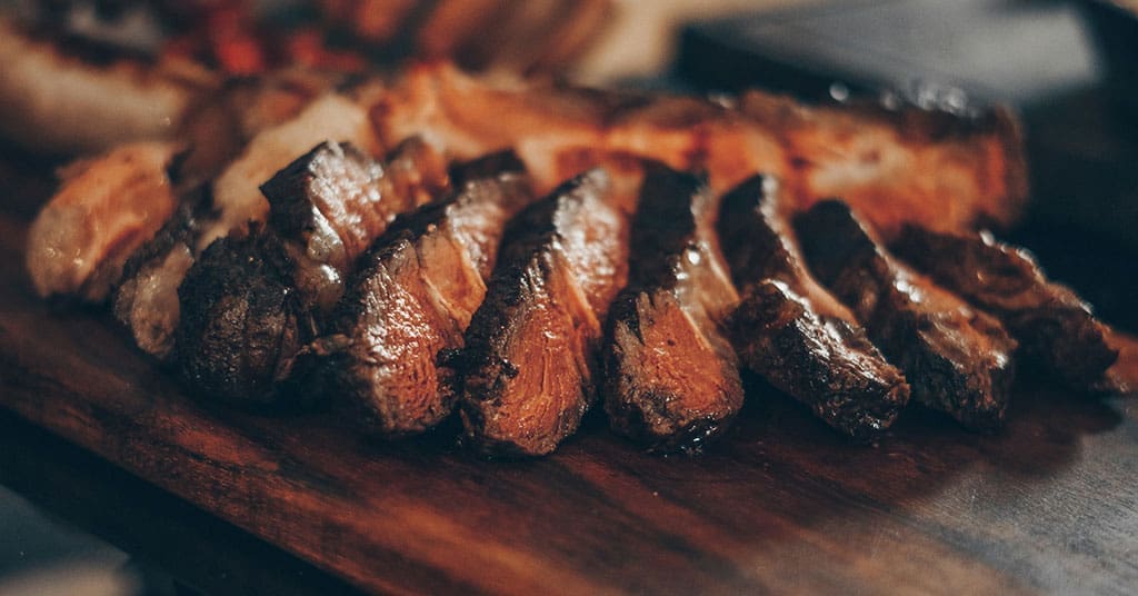 Beef prices in Canada have surged due to a shrinking cattle herd, high transportation costs, and potential market collusion