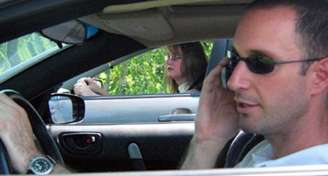 CellphoneGuy-650 • Troy Media Driving on cellphone