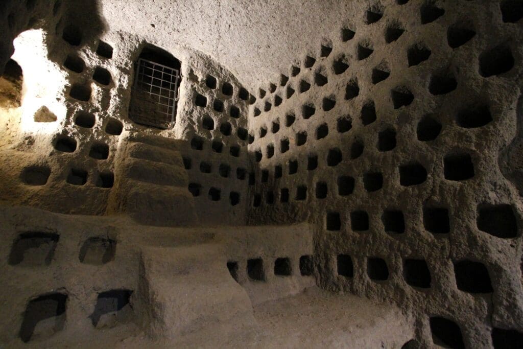 In medieval times, the people of Orvieto farmed pigeons. The holes in the volcanic tuff are nests