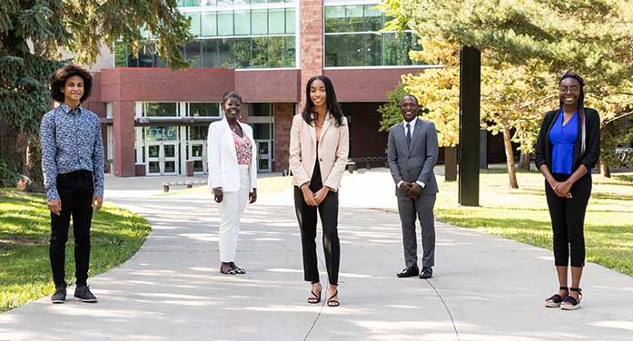 ELITE program student Severino Asumu, Professor Sedami Gnidehou, student Yanela Gonzalez Sanchez, Professor André McDonald and student Imani Murray