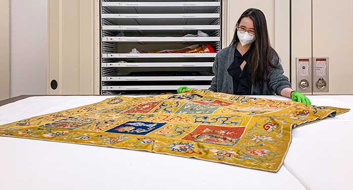 Arts-student-Sung-Eun-Cho-with-Buddhist-monk-silk-robe-697 • Troy Media Arts student Sung Eun Cho with Buddhist monk silk robe