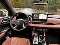 The redesigned cabin of the 2026 Mitsubishi Outlander PHEV is quieter and features a larger centre console with more storage and a bigger armrest