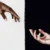 black white hands meet help
